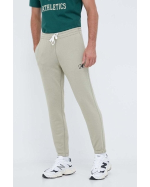 New Balance spodnie dresowe kolor zielony gładkie