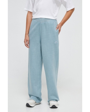 Reebok Classic spodnie dresowe kolor niebieski gładkie