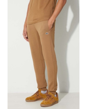 Lacoste spodnie dresowe męskie kolor brązowy gładkie
