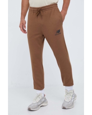 New Balance spodnie dresowe kolor brązowy z nadrukiem