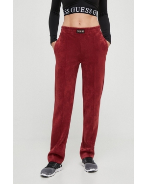 Guess spodnie dresowe kolor czerwony gładkie