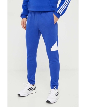 adidas spodnie dresowe kolor niebieski z nadrukiem IR9178
