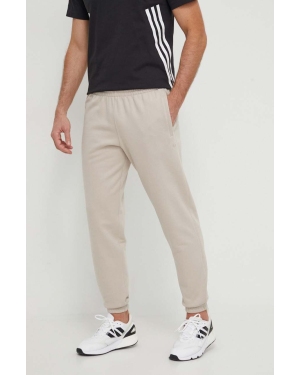 adidas Originals spodnie dresowe bawełniane kolor beżowy gładkie