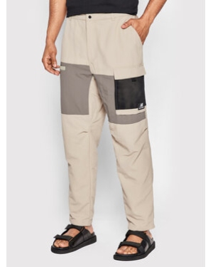 New Balance Spodnie materiałowe MP21502 Beżowy Relaxed Fit