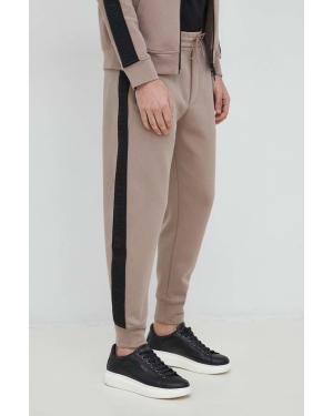 Emporio Armani spodnie dresowe męskie kolor beżowy z aplikacją
