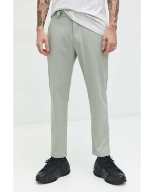 Tommy Jeans spodnie męskie kolor zielony w fasonie chinos